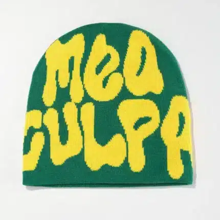 Green beanie with MEA CULPA in yellow letters.