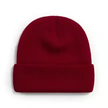 Maroon knit beanie with ribbed pattern and folded cuff for warmth.