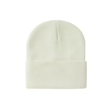 Cream-colored knit beanie with folded cuff on white background.