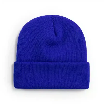 Vibrant blue knit beanie on white background.