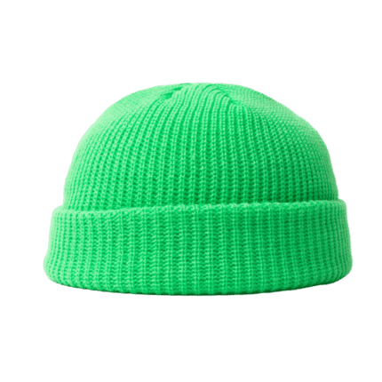 Green knitted beanie hat on matching green background.