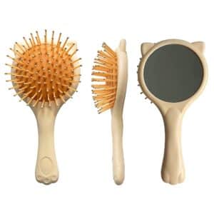 Cat-themed hairbrush set with ergonomic handles and mirror, displayed on a light background.