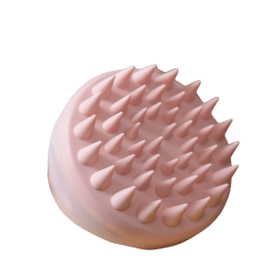 Pale pink scalp or pet grooming massager with conical, flexible bristles on a semi-circular base.