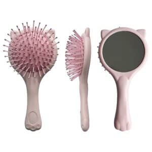 Pastel pink cat-themed hairbrush and hand mirror set with playful design.