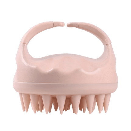 Ergonomic pink silicone scalp massaging brush with rounded bristles for gentle hair care.