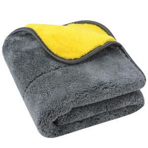 Dual-colored plush microfiber towel, yellow and grey, neatly folded, highlighting thickness and quality stitching.